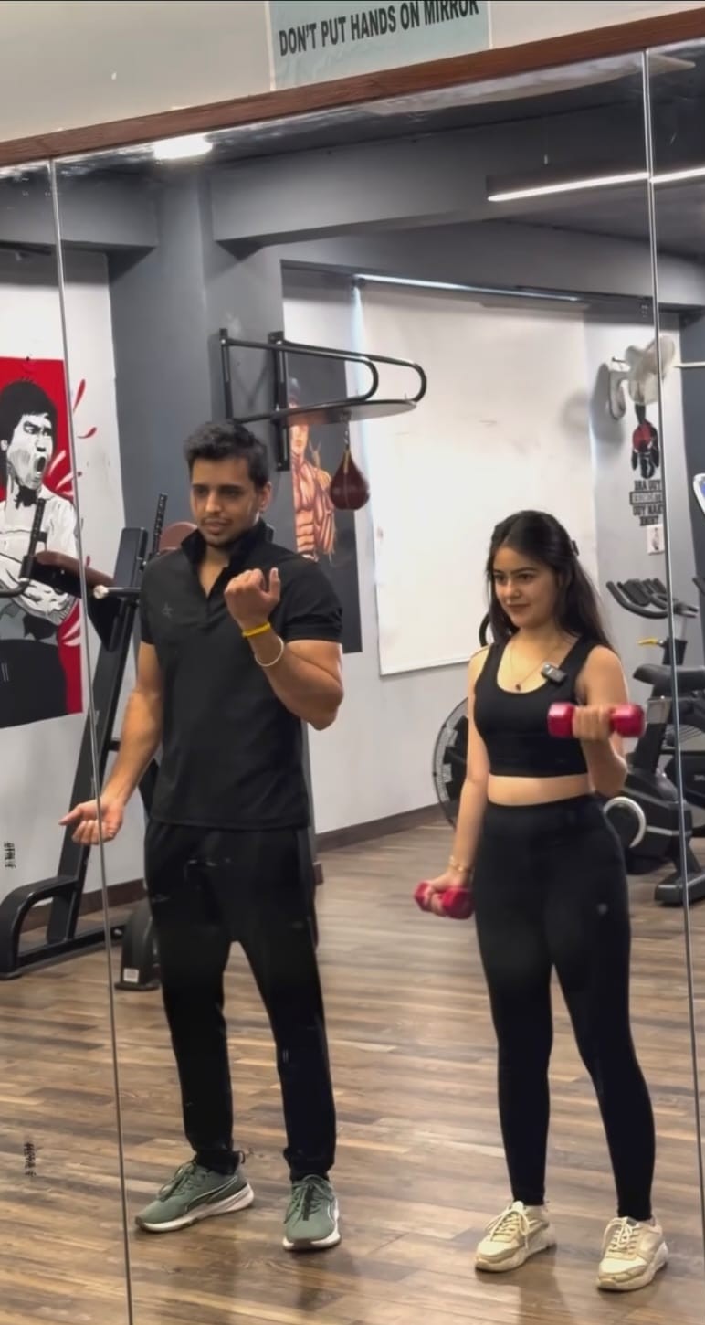 Personal trainer coaching a client at Revolution Fitness Jodhpur